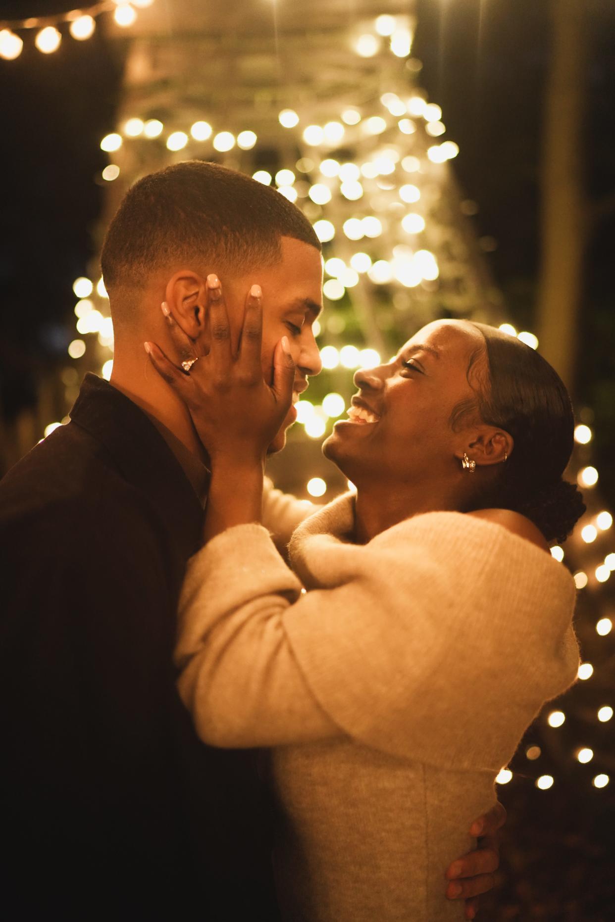 Belmiro Da Veiga Jr., of Brockton, proposes to Amber Jogie, of Boston, in front of the 24-foot Eiffel Tower replica that retired carpenter Steve Temple built in his backyard in Abington in 2020. Friends helped Belmiro prepare the replica for the surprise proposal.
(Josh Joseph photo)