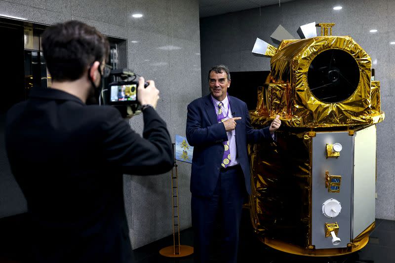 U.S. venture capitalist Tim Draper with his own videographer at the National Space Organization in Hsinchu