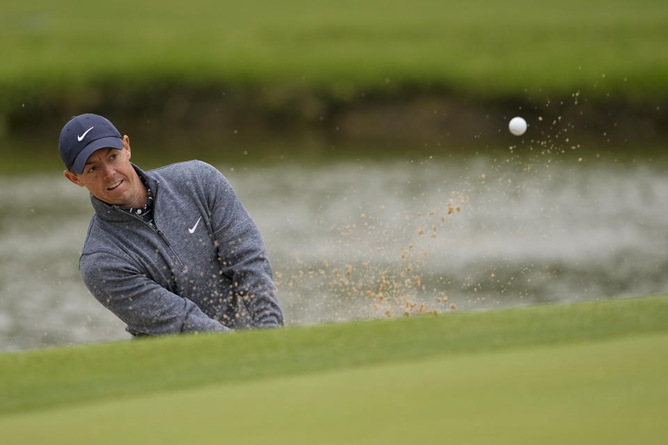 Rory McIlroy, of Northern Ireland, hits from the bunker on the 13th hole during the third round of the PGA Championship golf tournament at Southern Hills Country Club, Saturday, May 21, 2022, in Tulsa, Okla. (AP Photo/Matt York)