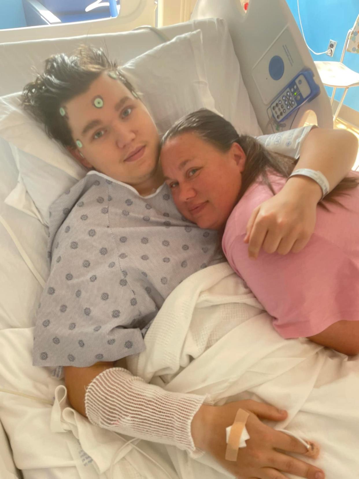 Zachary Gorsuch hugs his mom, Crystal, on May 12, 2023, before having the first of two brain surgeries.