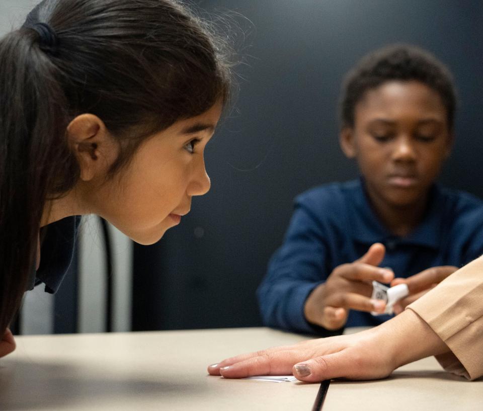 Daniela Nieves waits to play a reading game during a Circle City Readers tutoring session Thursday, Nov. 9, 2023, at Vision Academy at Riverside in Indianapolis.