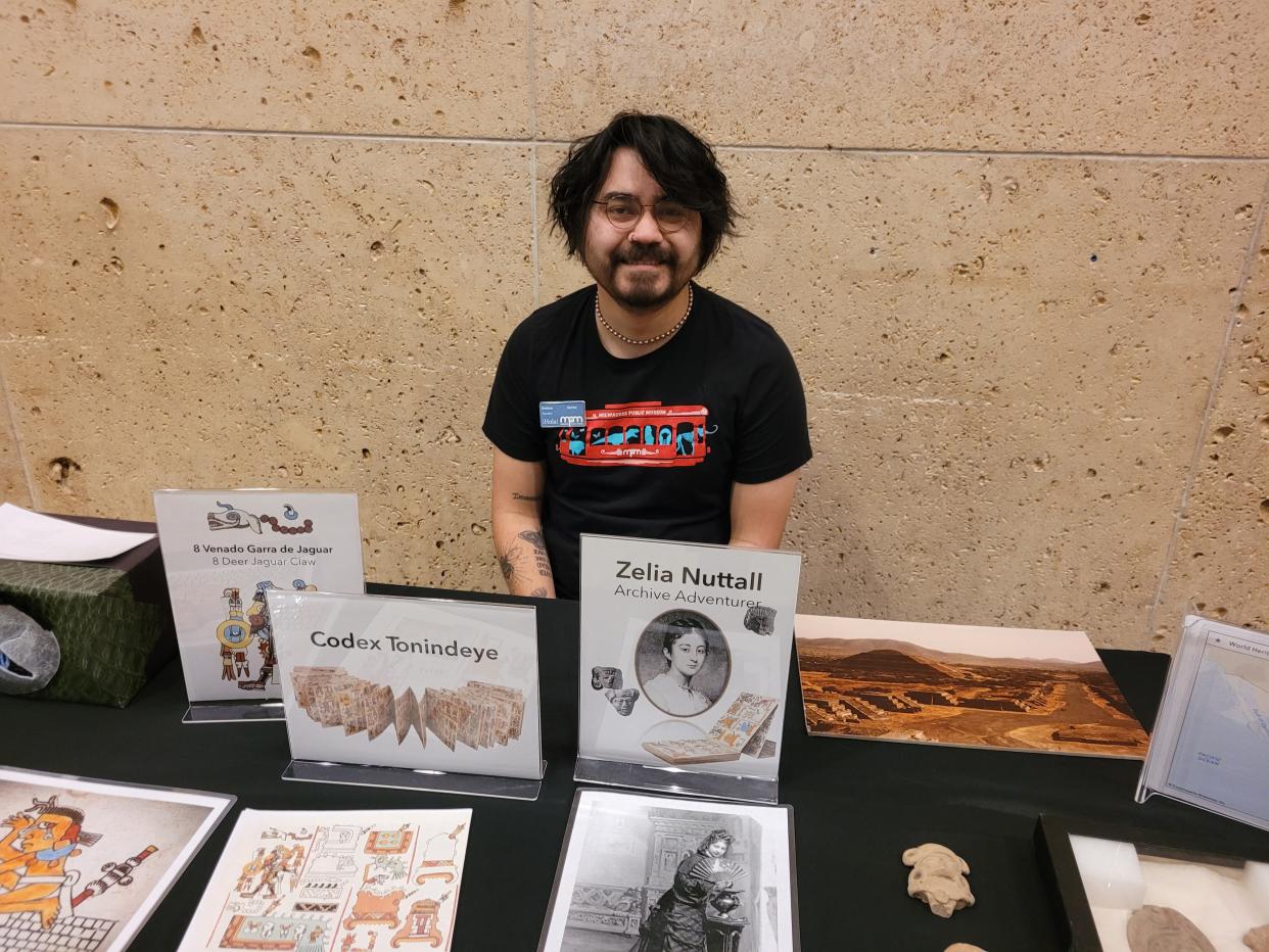 Emiliano Rodriguez, an educator at the Milwaukee Public Museum, presents information about Zelia Nuttall, an archaeologist who specialized in pre-Aztec Mexican cultures.