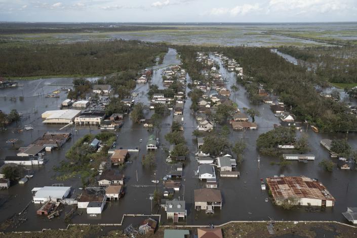 Homes and streets are overwhelmed by water on August 30, 2021 in Lafitte, Louisiana. (Michael Robinson Chavez/the Washington Post via Getty Images)   