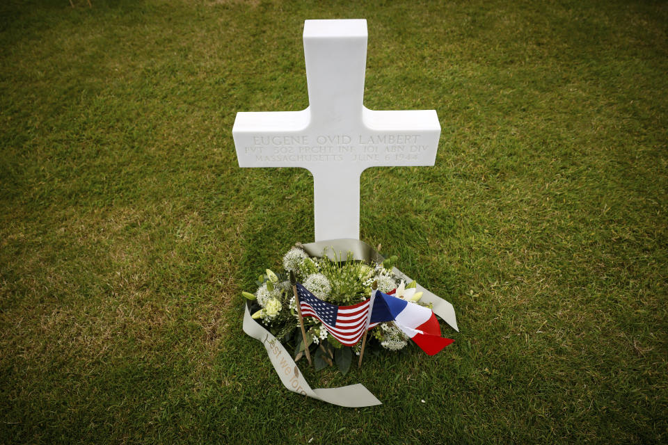 An American flag, left, and French flag lay at headstones in the American Cemetery in Colleville-sur-Mer, Normandy, Monday June 5, 2023. Dozens of World War II veterans have traveled to Normandy this week to mark the 79th anniversary of D-Day, the decisive but deadly assault that led to the liberation of France and Western Europe from Nazi control. (AP Photo/Thomas Padilla)