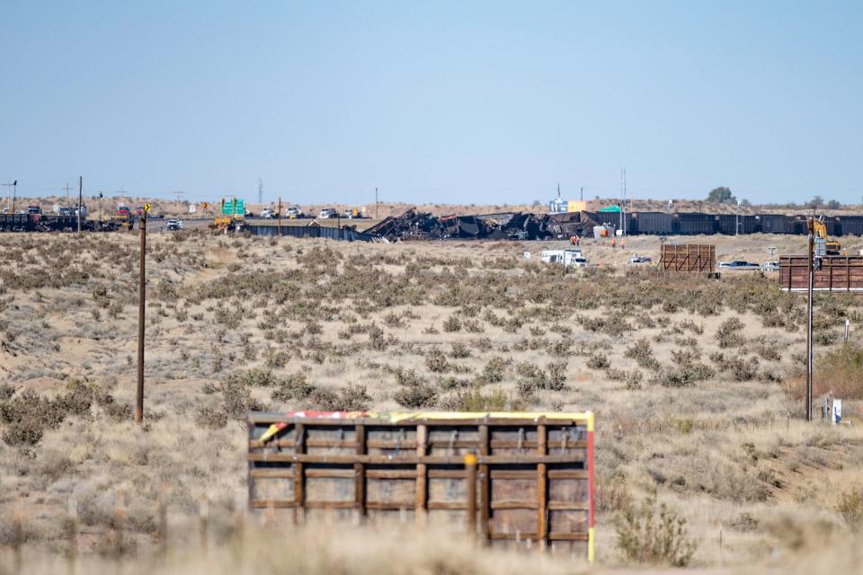 Crews work at the site of a fatal train derailment that took place in north Pueblo on Interstate 25 on Monday, Oct. 16, 2023.