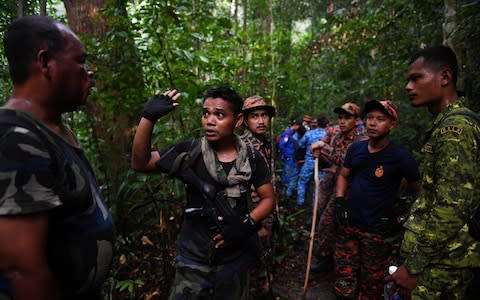 A 350-person search party searched for Nora before she was found on Tuesday - Credit: MOHD RASFAN/AFP