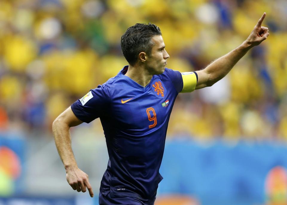 Robin van Persie of the Netherlands celebrates after scoring a goal from a penalty kick during their 2014 World Cup third-place playoff against Brazil at the Brasilia national stadium in Brasilia July 12, 2014. REUTERS/Dominic Ebenbichler (BRAZIL - Tags: SOCCER SPORT WORLD CUP TPX IMAGES OF THE DAY)