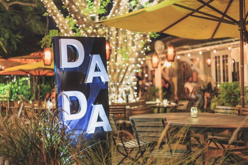 A majestic banyan tree anchors the front yard of Dada restaurant in Delray Beach.