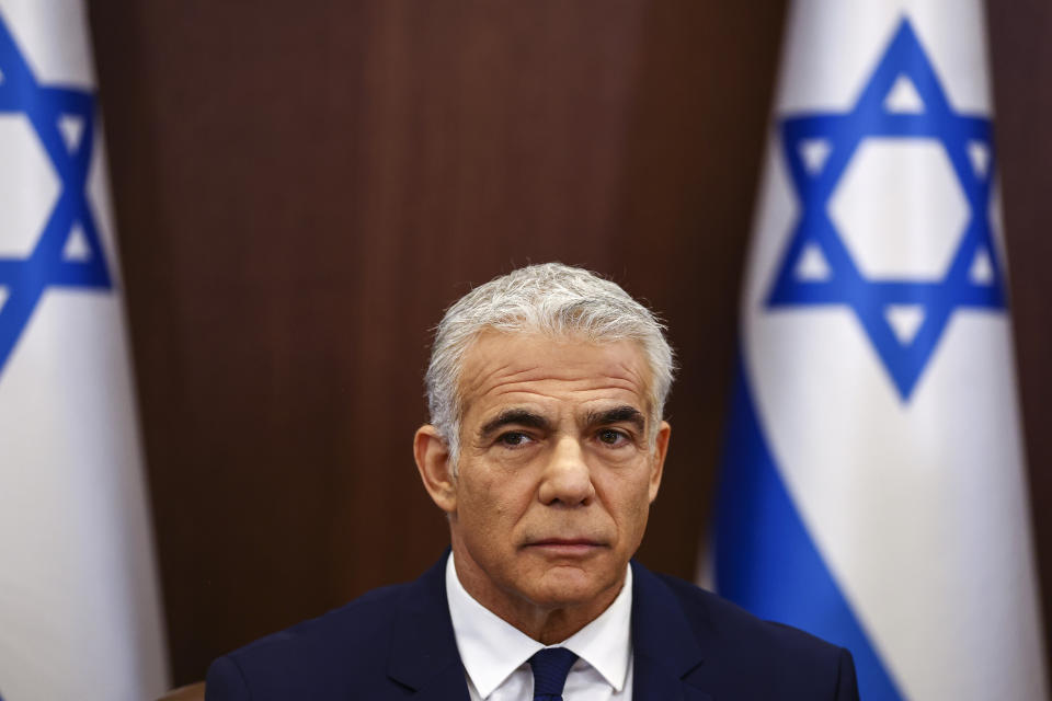 Israeli Prime Minister Yair Lapid holds a special cabinet meeting to approve U.S.-brokered deal setting a maritime border between Israel and Lebanon, at the Prime Minister's office in Jerusalem, Thursday, Oct. 27, 2022. Lebanon signed and delivered its copy of a U.S.-mediated sea border deal with Israel on Thursday to a U.S. mediator, hoping to soon start exploring gas in its southern maritime blocs to bring economic stability to the crisis-ridden country. (Ronen Zvulun/Pool Photo via AP)