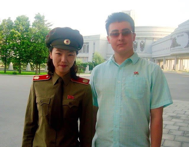 Jack with a military guide  outside the War Atrocities Museum, Pyongyang. Source: Caters