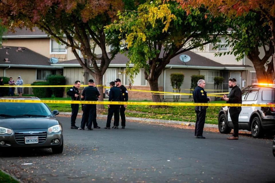 Police tape off a central Fresno, California neighborhood to investigate a shooting between two groups on Monday, Nov. 29, 2021., that left a bystander hurt.