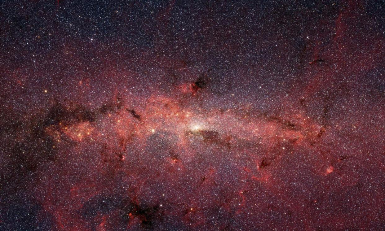 <span>Nasa, who captured this image of the centre of the Milky Way using the Spitzer space telescope’s infrared cameras, has contracted SpaceX to land astronauts on the moon.</span><span>Photograph: Nasa/AFP/Getty Images</span>