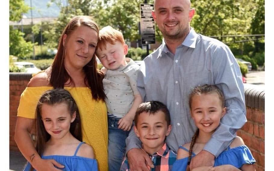 Mr Stevens pictured with partner Laura Burford and four of their children - ugc/Daily Post Wales