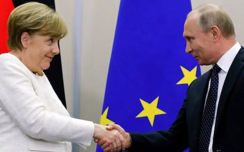 merkel putin - Credit: AP