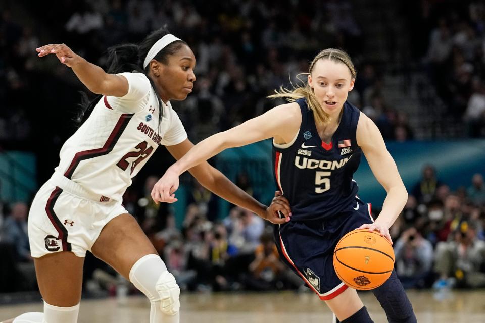 UConn's Paige Bueckers tries to get past South Carolina's Bree Hall during the national championship game on April 3 in Minneapolis. (AP Photo/Eric Gay)