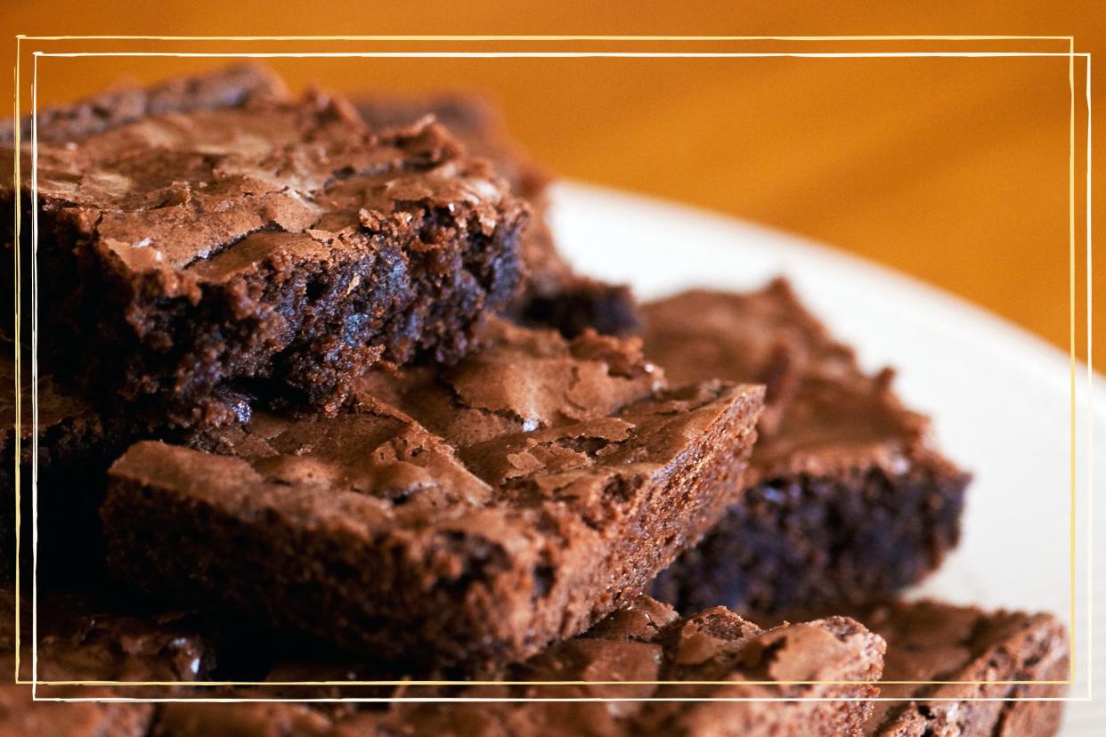  A close up of a stack of chocolate brownies. 