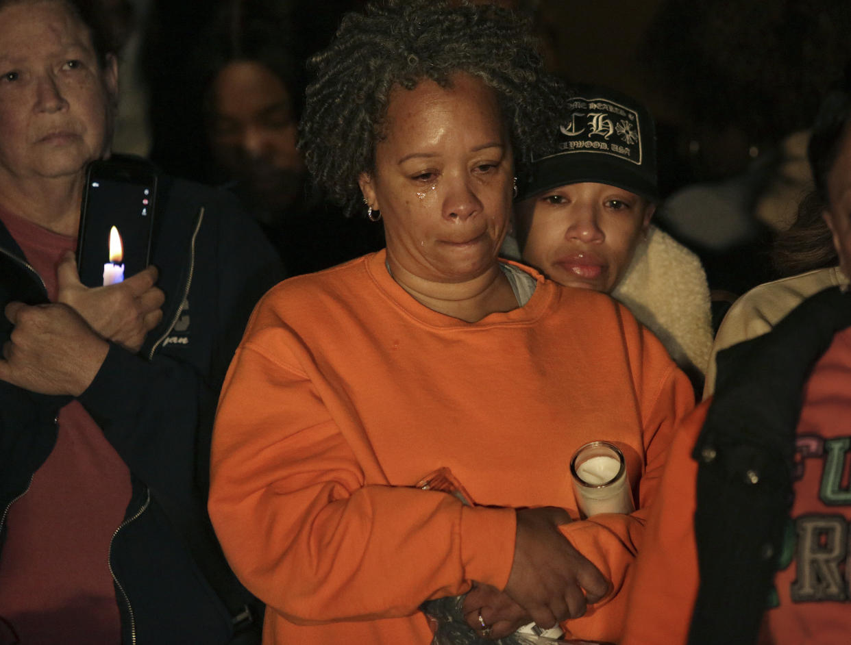 Adrian Blakemore, right, and her mother Erleen Hughs mourn the loss of Sierra Jenkins, Blakemore's best friend, during a vigil Sunday, March 20, 2022, at Granby High School in Norfolk, Va. Jenkins, a reporter for the Virginian-Pilot, died at a Norfolk hospital after being shot during a shooting early Saturday outside a restaurant and bar. (Stephen M. Katz/The Virginian-Pilot via AP)