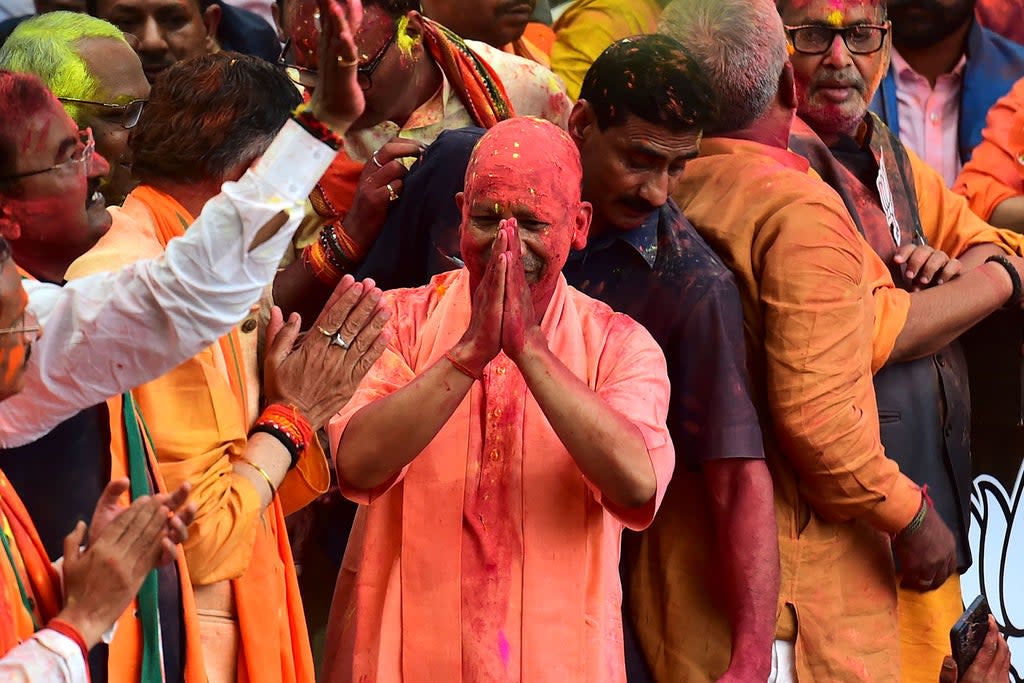 Chief Minister of India’s Uttar Pradesh state Yogi Adityanath with his supporters after Bharatiya Janata Party’s (BJP) win in the state assembly elections (Getty)