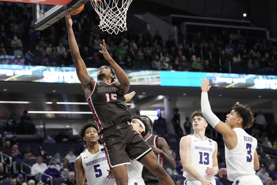 Brown forward Kalu Anya (15) drives to the basket against Northwestern during the first half of an NCAA college basketball game in Evanston, Ill., Thursday, Dec. 29, 2022. (AP Photo/Nam Y. Huh)