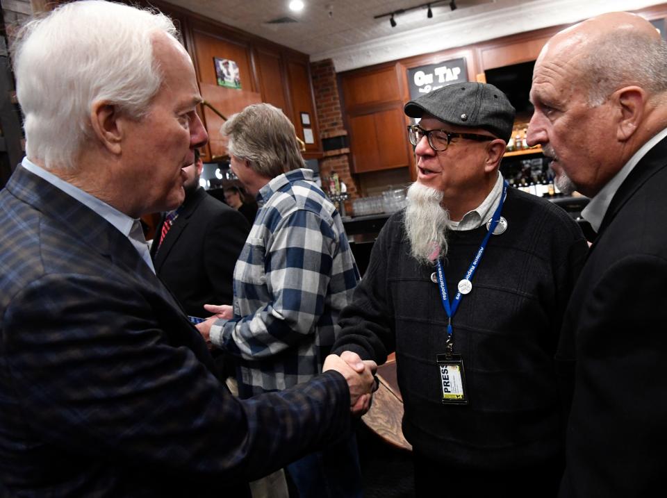 U.S. Sen. John Cornyn shakes hands with ARN Editor Greg Jaklewicz during his Super Tuesday stop in Abilene .