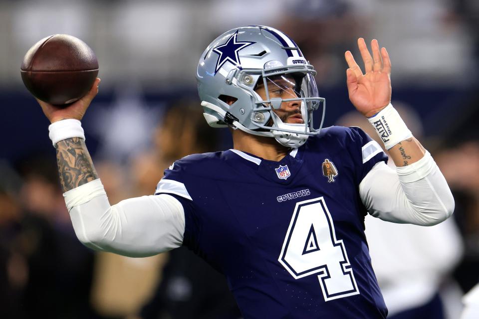 Dak Prescott of the Dallas Cowboys warms up prior to the game against the Detroit Lions at AT&T Stadium on December 30, 2023 in Arlington, Texas.