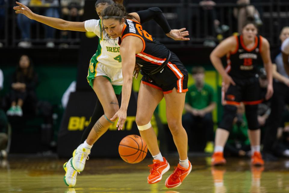 Oregon’s Priscilla Williams, left, and Oregon State’s Talia von Oelhoffen collided at mid court during the first half at Matthew Knight Arena Sunday, Feb 4, 2024.