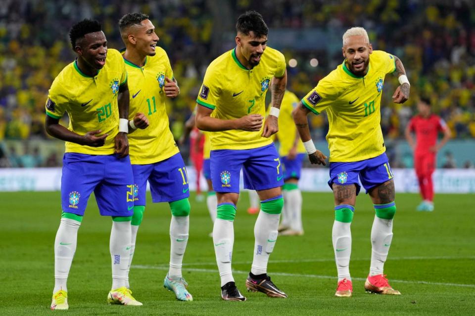 Brazil’s players dance as they celebrate scoring against South Korea (AP)