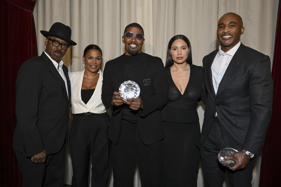 Courtney B. Vance, Nia Long, Jamie Foxx, Jurnee Smollett and Datari Turner pose with the Producers Award for Foxxhole Productions at the AAFCA Special Achievement Awards Luncheon held at the Los Angeles Athletic Club on March 3, 2024 in Los Angeles, California.