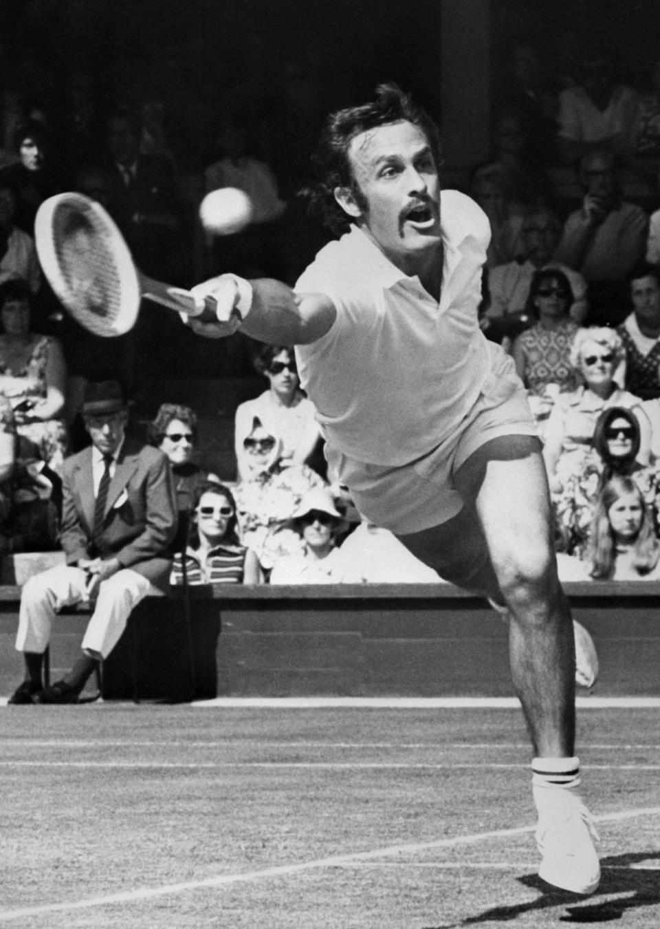 <p>Australian tennis player John Newcombe returns a ball against G. Battrick in June 1971.</p>