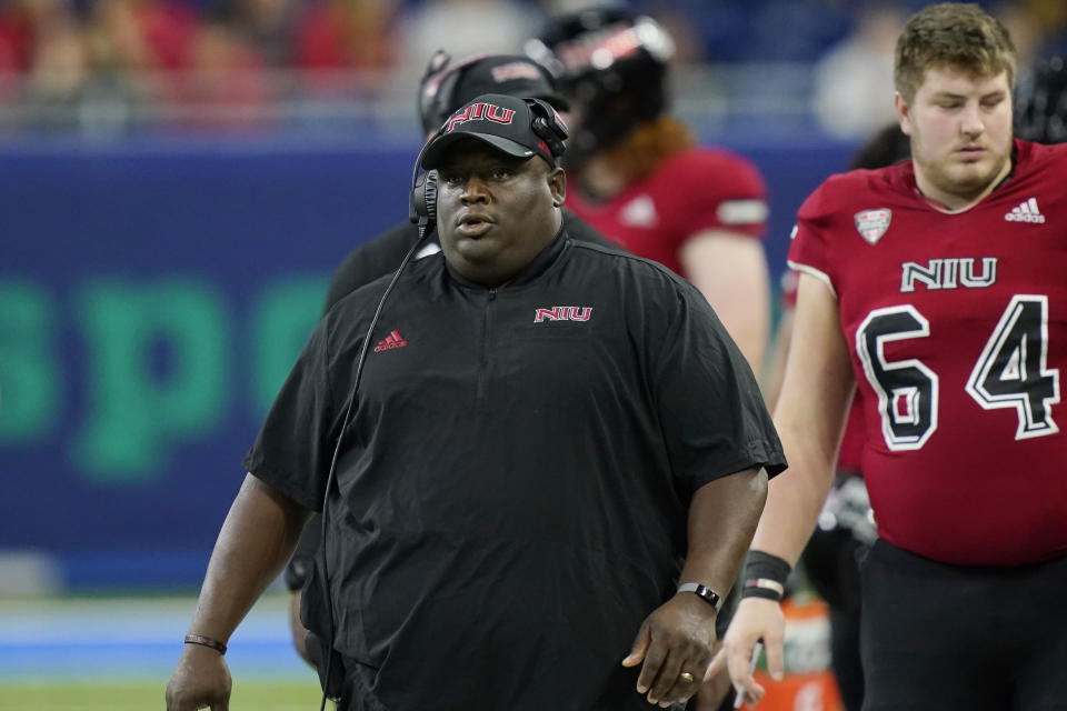 FILE -Northern Illinois head coach Thomas Hammock walks the sideline during the first half of an NCAA college football game against Kent State, Saturday, Dec. 4, 2021, in Detroit. Northern Illinois went from lovable underdog to leader of the Mid-American Conference pack in one season. Keeping the title will be no walk in the park for the Huskies. After going from winless in 2020 to conference champs in 2021, The Huskies will try to become just the third team since 2001 to win consecutive conference crowns and the first since Northern Illinois last achieved the feat in 2011-12. (AP Photo/Carlos Osorio, File)