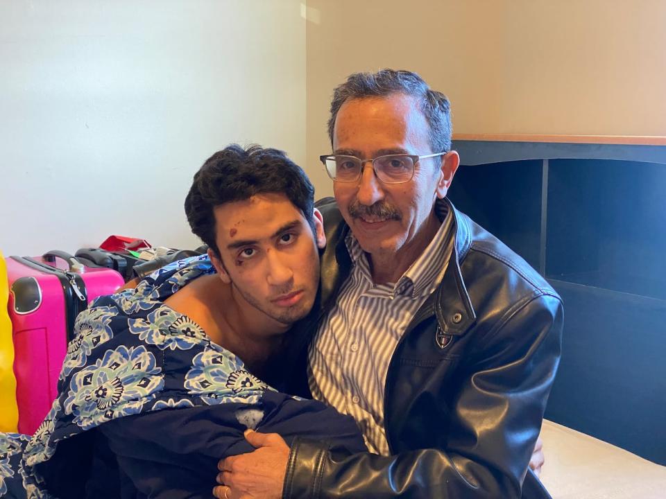 Majd Darwich (right) says his son Abdullah hasn't been the same since he was tasered and handcuffed by police on Friday after wandering away from home. The incident also left the 19-year old, who is autistic and non-verbal, with cuts, bruises and sores from the tasers. 