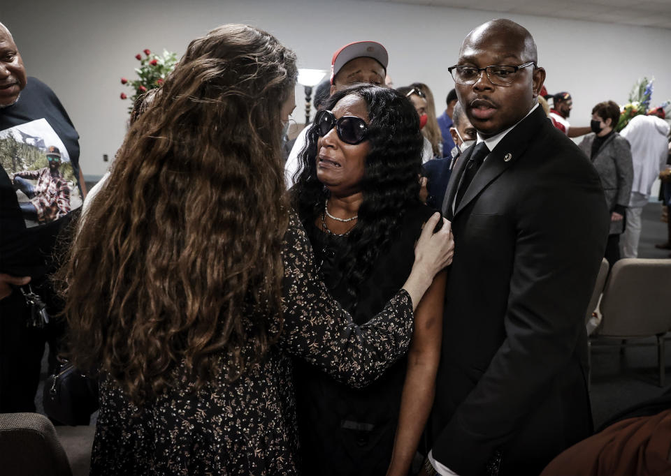 RowVaughn Wells, center, mother of Tyre Nichols, is comforted during a memorial service for her son on Tuesday, Jan. 17, 2023, in Memphis, Tenn. Nichols was killed during a traffic stop with Memphis Police on Jan. 7. (Mark Weber/Daily Memphian via AP)