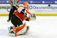 Philadelphia Flyers goalie Brian Elliott (37) makes a save during the second period of an NHL hockey game against the Buffalo Sabres, Saturday, Feb. 27, 2021, in Buffalo, N.Y. (AP Photo/Jeffrey T. Barnes)