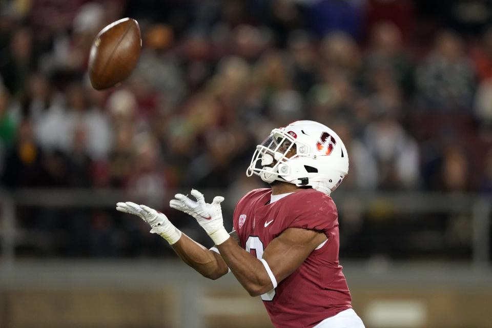 Stanford running back Nathaniel Peat (8) catches a kickoff against Notre Dame during a game Nov. 27 at Stanford Stadium in Stanford, Calif.