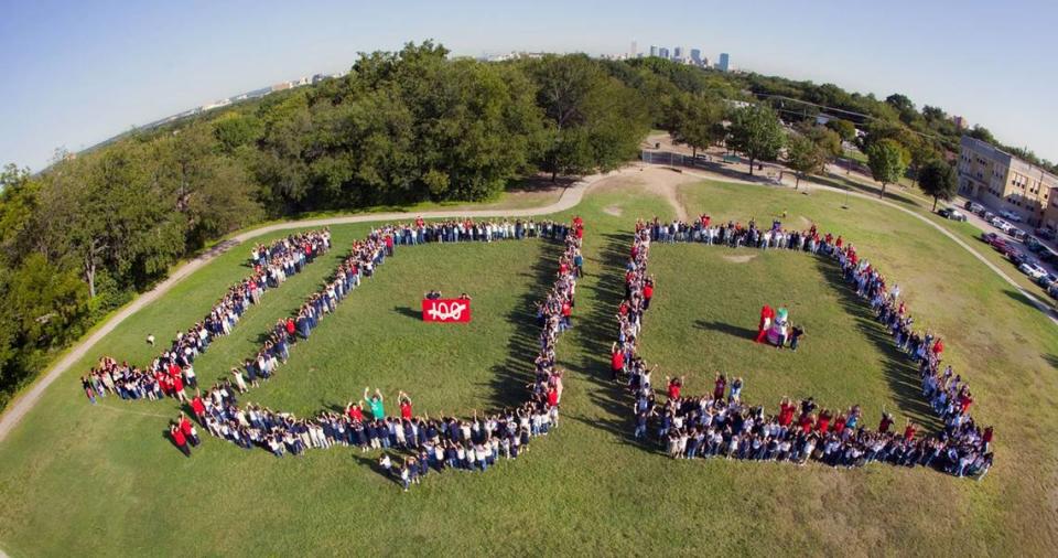 2009: When the entire student body, plus teachers and some parents, formed “100” in tribute to E.M. Daggett’s century celebration on Tuesday September 29, 2009, it was so big it required a super wide-angle lens which curved the Fort Worth horizon.