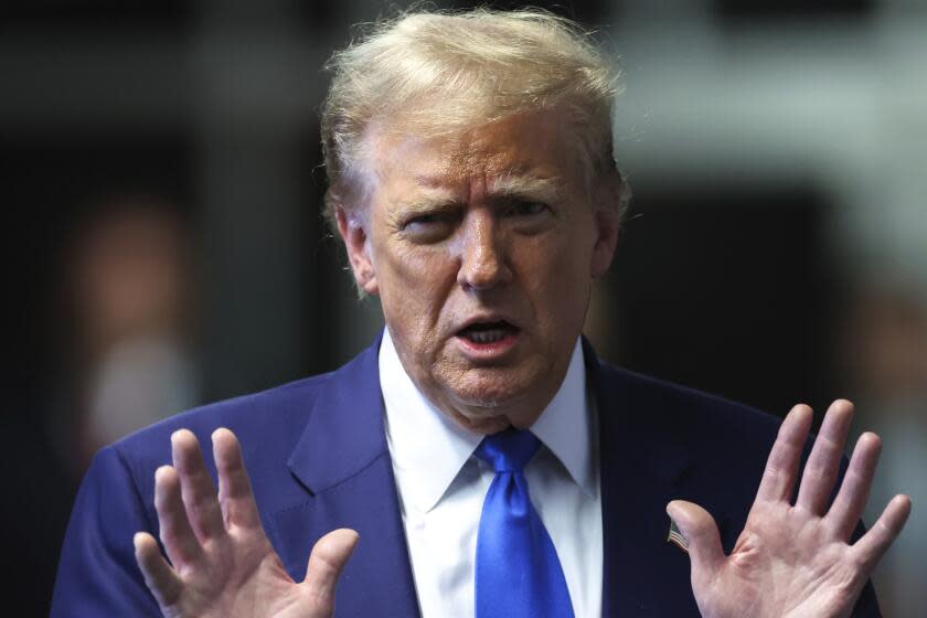 Former President Donald Trump speaks to media as he returns to his trial at the Manhattan Criminal Court, Friday, May 3, 2024, in New York. (Charly Triballeau/Pool Photo via AP)