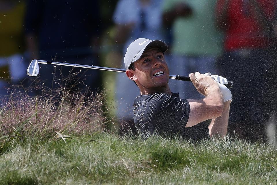 Rory McIlroy hits out of a bunker on the fifth hole during the third round of the Dell Technologies Championship golf tournament at TPC Boston in Norton, Mass., Sunday, Sept. 2, 2018. (AP Photo/Michael Dwyer)