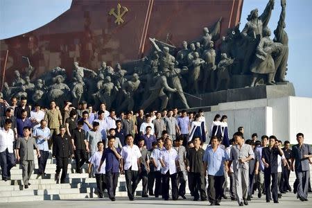 North Koreans visit Mansudae in Pyongyang, in this photo taken by Kyodo on September 9, 2015, to mark the 67th anniversary of the nation's founding. Mandatory credit REUTERS/Kyodo