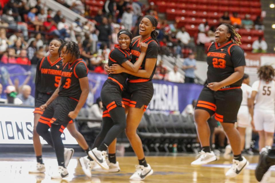 Hornets celebrate on the floor as they pulled off a come from behind win over Graceville. Hawthorne Hs Hornets vs the Graceville Tigers at the FHSAA Girls 1A Championship at the RP Funding Center in Lakeland Fl. Saturday March 2nd 2024, 2024 Photo by Calvin Knight