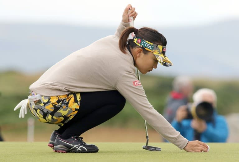 Taiwan's Teresa Lu places her ball on the 13th green, during her third round, on day three of the Women's British Open Golf Championships in Turnberry, Scotland, on August 1, 2015