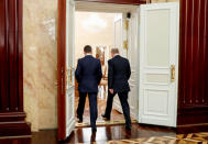 Russian President Vladimir Putin, right, and Russian Prime Minister Dmitry Medvedev leaves a cabinet meeting in Moscow, Russia, Wednesday, Jan. 15, 2020. The Tass news agency reports Wednesday that Russian Prime Minister Dmitry Medvedev submitted his resignation to President Vladimir Putin. Russian news agencies said Putin thanked Medvedev for his service but noted that the prime minister's Cabinet failed to fulfill all the objectives set for it. (Dmitry Astakhov, Sputnik, Government Pool Photo via AP)