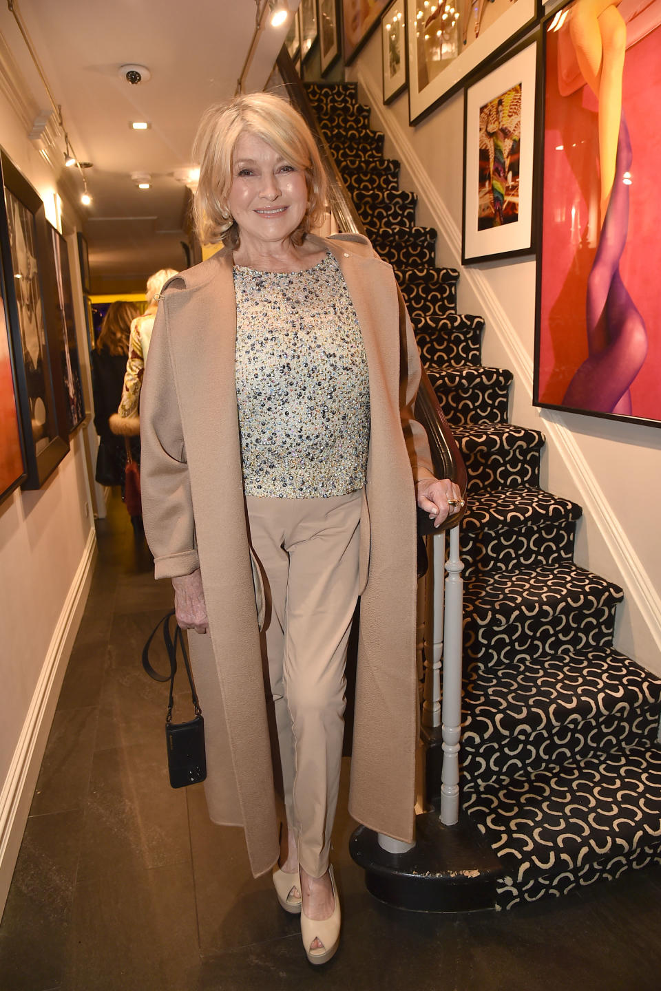 Martha poses next to a staircase