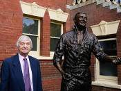 Benaud alongside his statue at the Sydney Cricket Ground.