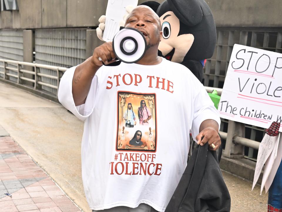 A man holding a megaphone.