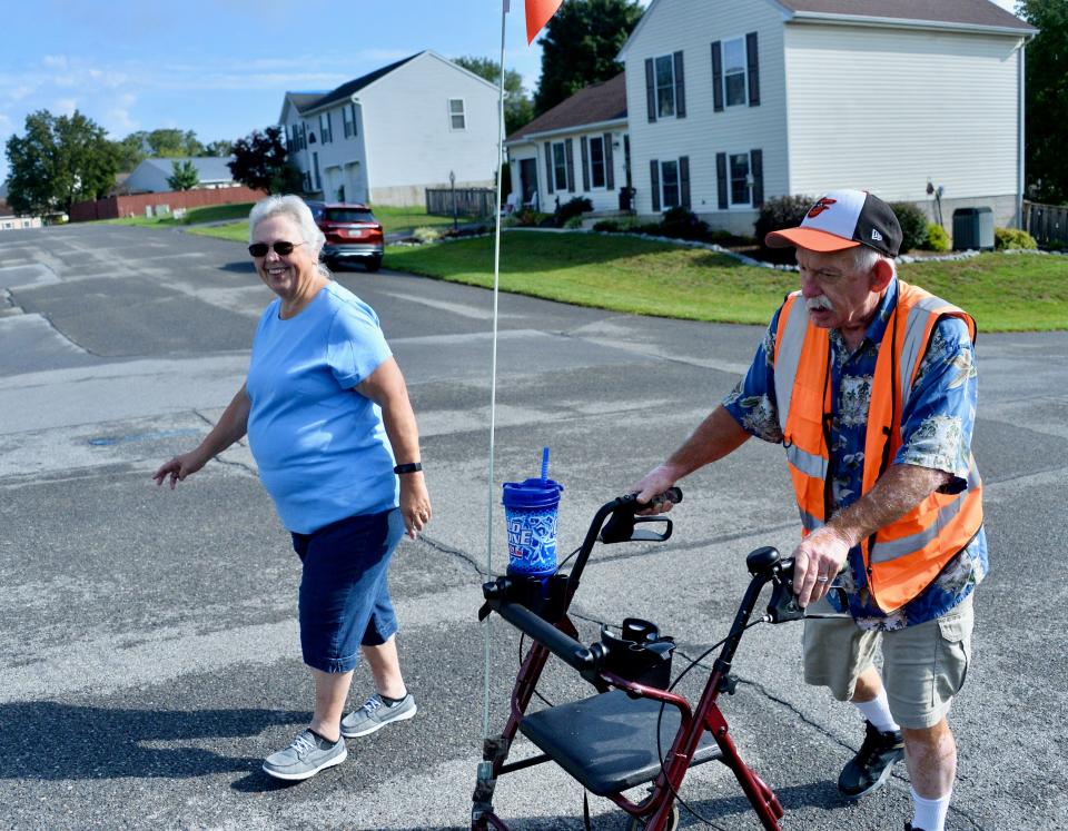 Linda Norris joins her husband, Robert, for a Friday morning walk around their Hagerstown-area neighborhood. Robert was named 2022 TOPS Maryland King for losing the most weight among TOPS males in the state who reached their weight goal last year.