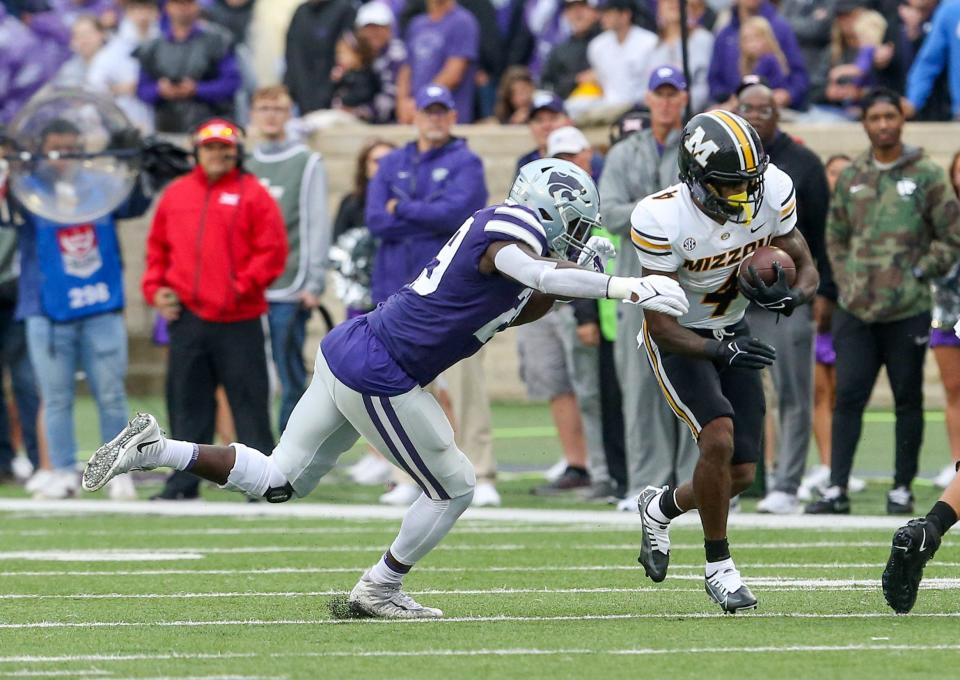 Sep 10, 2022; Manhattan, Kansas, USA; Missouri Tigers running back Elijah Young (4) is tackled by Kansas State Wildcats linebacker Khalid Duke (29) during the first quarter at Bill Snyder Family Football Stadium. Mandatory Credit: Scott Sewell-USA TODAY Sports