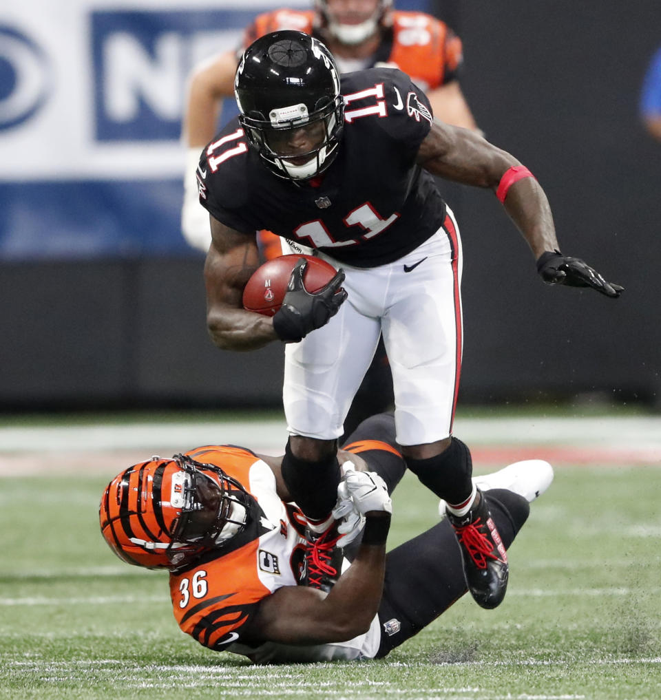 <p>Cincinnati Bengals defensive back Shawn Williams (36) ties up Atlanta Falcons wide receiver Julio Jones (11) during the first half of an NFL football game, Sunday, Sept. 30, 2018, in Atlanta. (AP Photo/John Bazemore) </p>