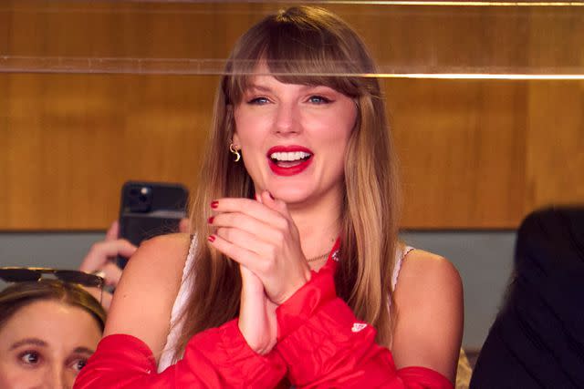 <p>Cooper Neill/Getty</p> Taylor Swift cheers from a suite as the Kansas City Chiefs play the Chicago Bears at GEHA Field at Arrowhead Stadium on September 24, 2023 in Kansas City, Missouri