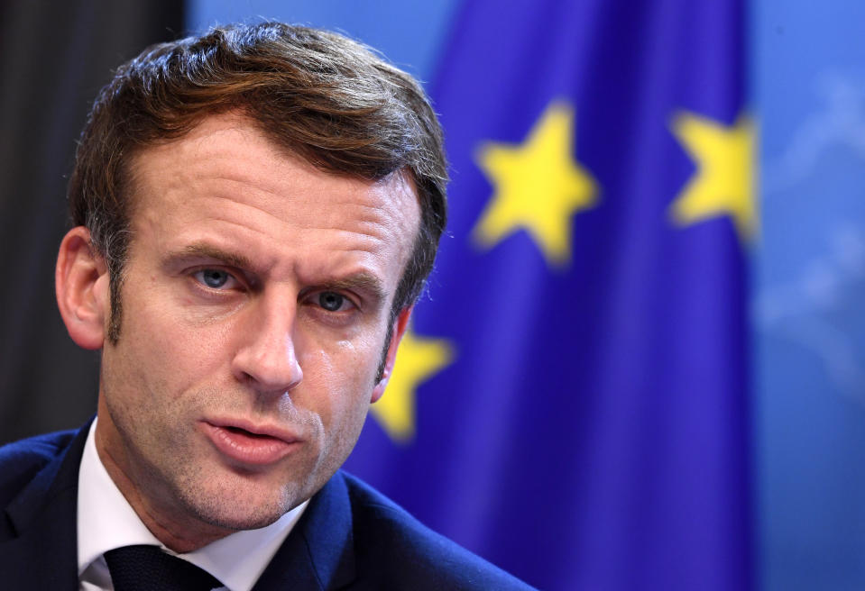 FILE- French President Emmanuel Macron addresses a media conference at the conclusion of an EU Summit in Brussels, Friday, Dec. 17, 2021. President Emmanuel Macron has provoked outcries in parliament and shrill protests from election rivals by using a vulgarity to describe his strategy for pressuring vaccine refusers to get coronavirus jabs. (John Thys, Pool Photo via AP, FIle)