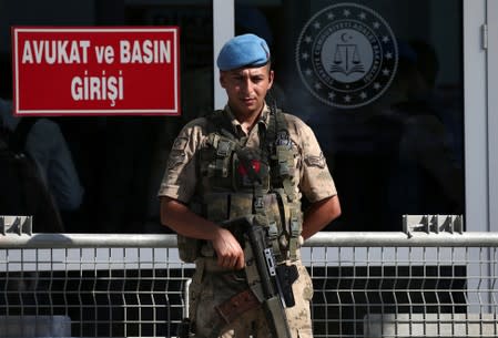 A Turkish soldier stands guard outside a courtroom at the Silivri Prison and Courthouse complex in Silivri near Istanbul
